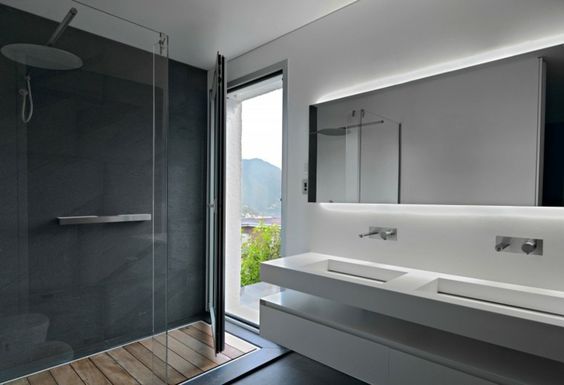 Diseño minimalista en un baño de hormigón encerado